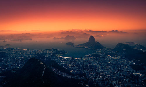 High angle view of cityscape against sky during sunset