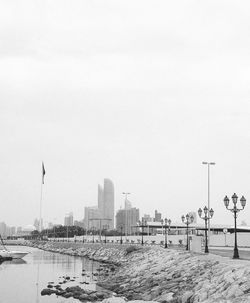 View of buildings in city against clear sky