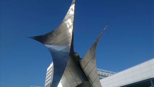 Low angle view of built structure against clear blue sky