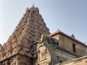 Low angle view of a temple building against clear sky