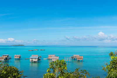 Scenic view of sea against blue sky