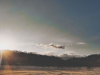 Scenic view of field against sky during sunset
