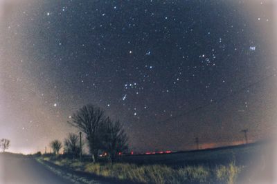 Road against sky at night