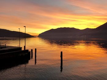 Scenic view of lake against sky during sunset