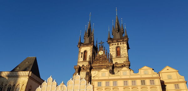 Low angle view of temple building against clear blue sky