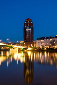 Illuminated buildings at waterfront