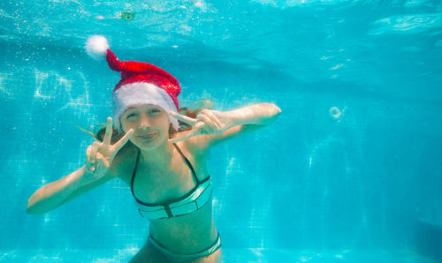 Woman swimming in sea