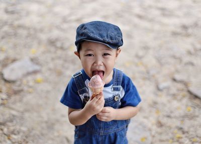 Portrait of cute boy eating ice cream