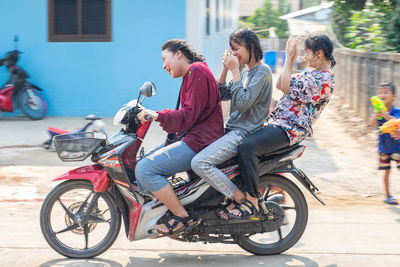 People riding bicycle in city