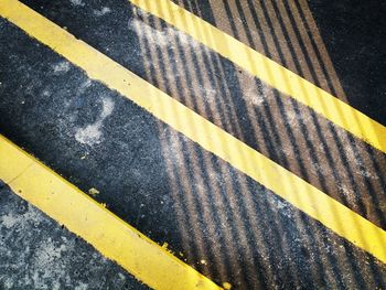 High angle view of yellow zebra crossing on road