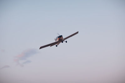 Low angle view of airplane against clear sky