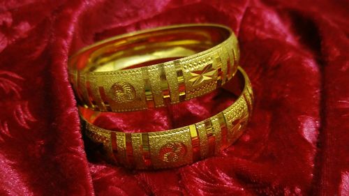 Close-up of gold colored pencils