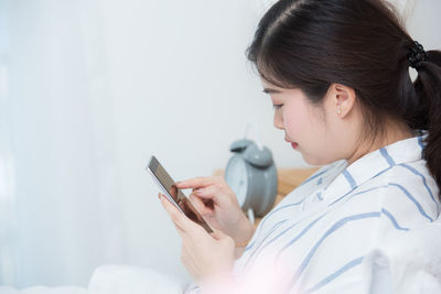 Young woman using mobile phone