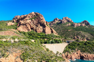 Scenic view of mountain against clear blue sky