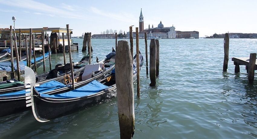 water, nautical vessel, transportation, boat, sea, mode of transport, moored, waterfront, wooden post, pier, wood - material, rippled, sky, built structure, day, nature, outdoors, blue, tranquility, no people