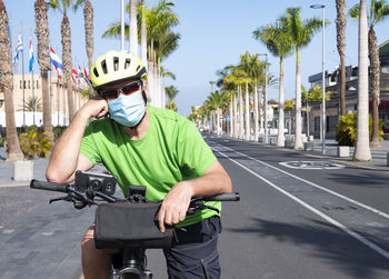 Man riding bicycle on road