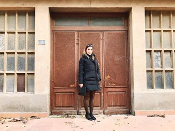 Woman standing in front of building