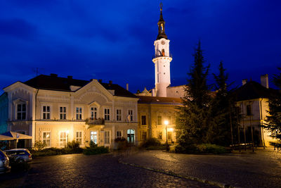 Illuminated building against sky at night