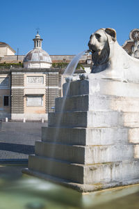 Low angle view of statue against sky