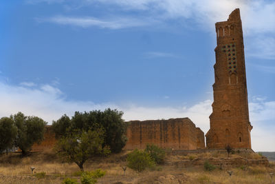 Low angle view of castle against cloudy sky