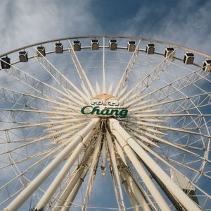 Low angle view of ferris wheel against sky