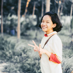 Portrait of smiling woman standing outdoors