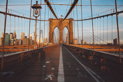 Road marking and arrow symbols on brooklyn bridge in city