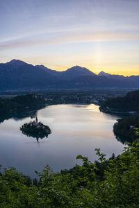 Scenic view of lake against sky during sunset