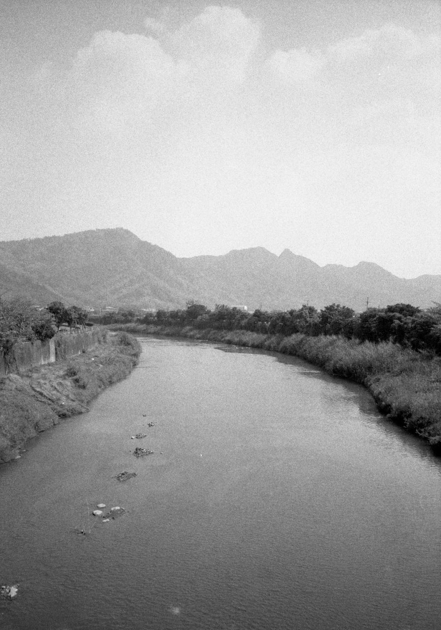 black and white, water, mountain, sky, monochrome photography, scenics - nature, monochrome, tranquility, nature, beauty in nature, tranquil scene, no people, environment, land, landscape, mountain range, cloud, day, lake, non-urban scene, outdoors, coast