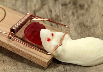Close-up of dessert and mousetrap on table