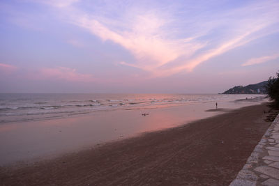 Scenic view of beach against sky during sunset