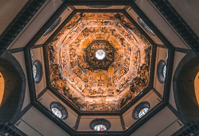 Low angle view of ornate ceiling in temple