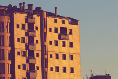 Low angle view of building against sky during sunset