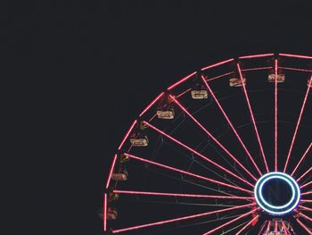 Low angle view of illuminated ferris wheel