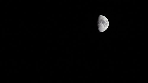 Low angle view of moon against sky at night