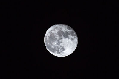 Low angle view of full moon at night