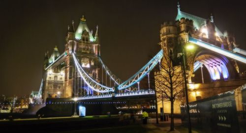 Illuminated bridge at night