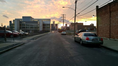 View of city street at sunset