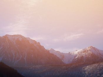 Scenic view of mountains against sky during sunset