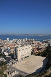 High angle shot of townscape against clear blue sky