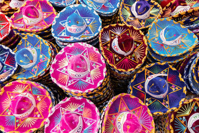 Full frame shot of multi colored souvenirs for sale at market stall