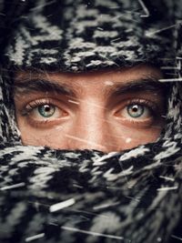 Close-up portrait of man in snow