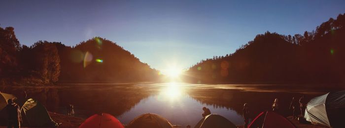 Panoramic view of camping site on mountain lake shore