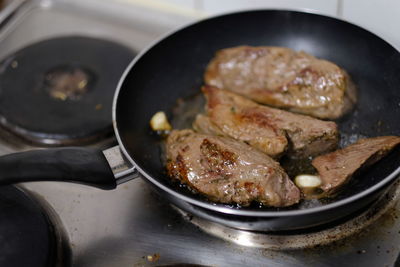 High angle view of meat in cooking pan