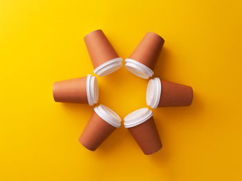 Directly above shot of yellow pencils over white background