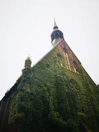 Low angle view of old church against sky