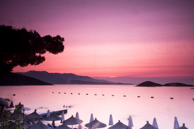 Scenic view of silhouette mountains against sky at sunset