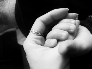 Close-up of couple holding hands