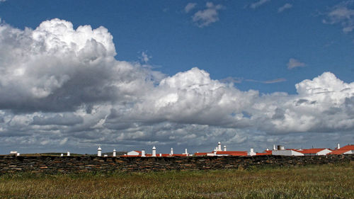 Panoramic view of field against sky