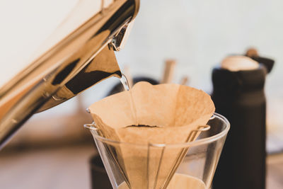 Close-up of coffee in glass on table